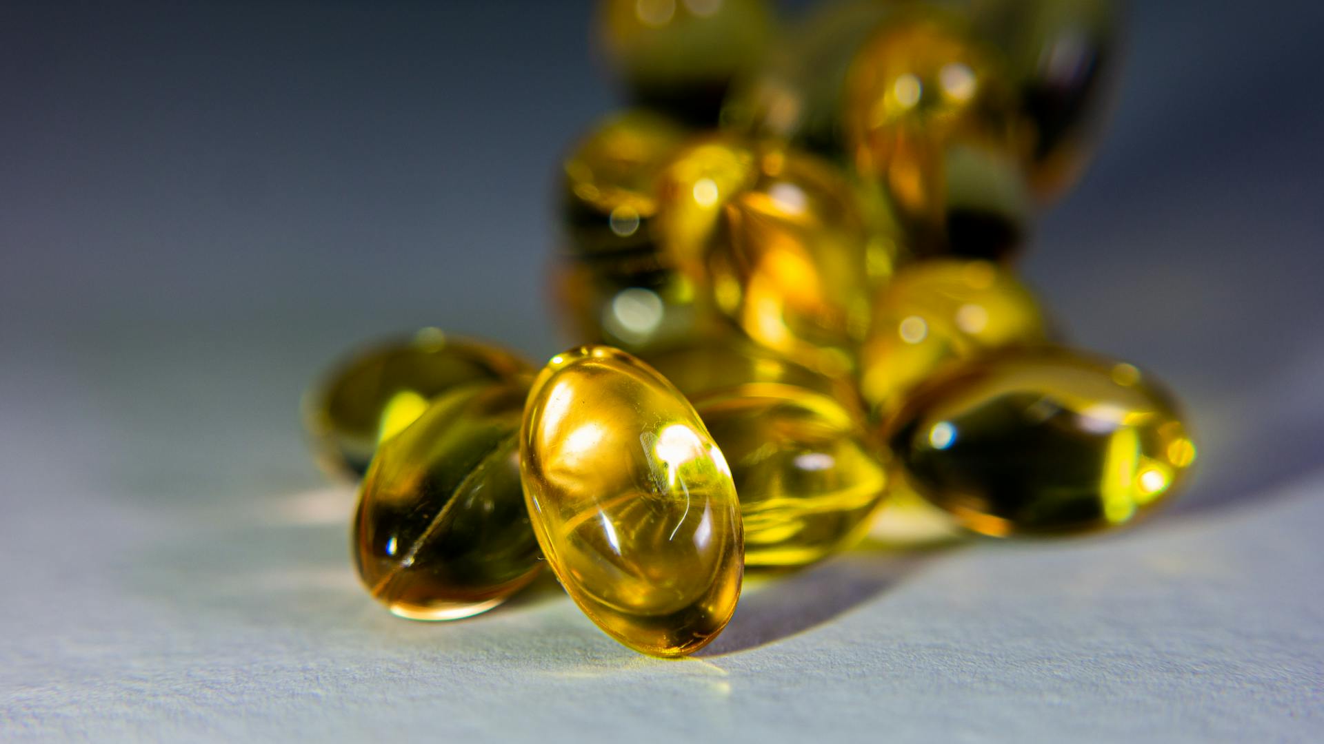Premium golden softgel capsules — WHO-GMP certified nutraceutical manufacturing by Admetus Lifesciences, Village Anta, Haryana
